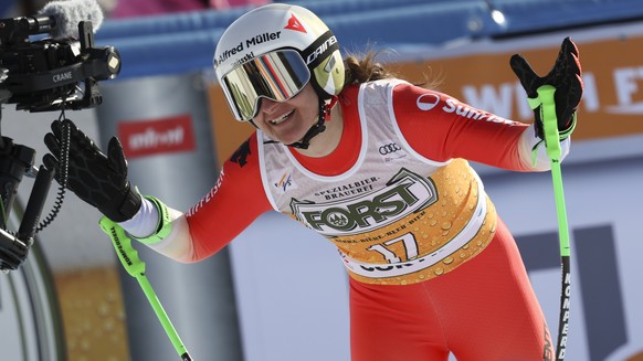 Switzerland&#039;s Priska Nufer celebrates at the finish area of an alpine ski, women&#039;s World Cup downhill race, in Cortina d&#039;Ampezzo, Italy, Saturday, Jan. 21, 2023. (AP Photo/Alessandro Tr ...