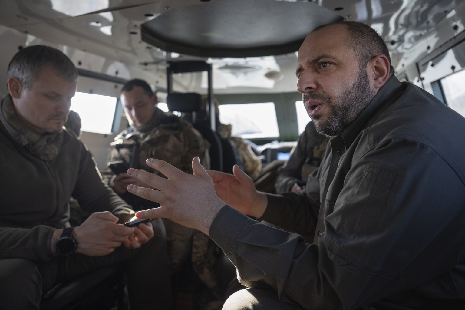 FILE - Ukrainian Defense Minister Rustem Umerov rides in an APC during a visit to the front-line city of Kupiansk, Kharkiv region, Ukraine, Thursday, Nov. 30, 2023. A gloomy mood hangs over Ukraine?s  ...