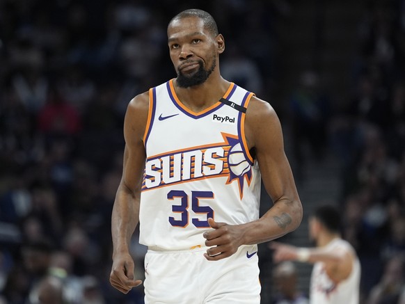 Phoenix Suns forward Kevin Durant jogs down the court during the second half of an NBA basketball game against the Minnesota Timberwolves, Friday, March 28, 2025, in Minneapolis. (AP Photo/Abbie Parr) ...