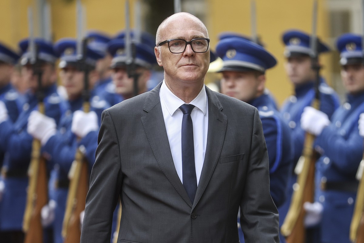 Switzerland's Martin Pfister, head of the Federal Department of Defence, Civil Protection and Sport, reviews the honour guard during a welcome ceremony in the Ministry of defence building in Sara ...
