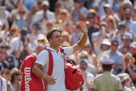 Arthur Fery of Britain waves to the crowd as he walks off Centre Court after loosing to Alexander Zverev of Germany in their men's singles semifinal match at the Wimbledon Tennis Championships in ...