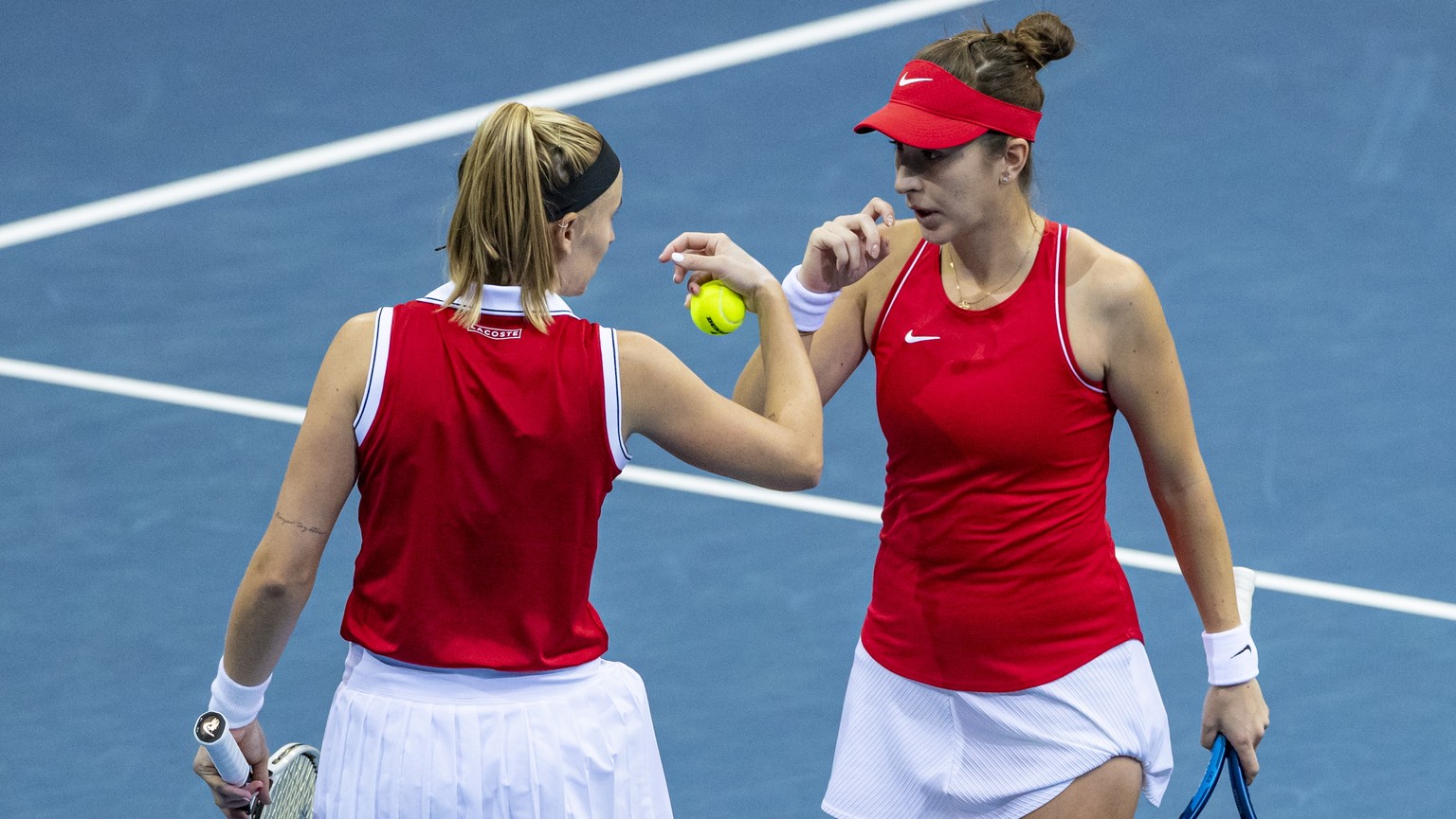 epa09564951 Belinda Bencic (R) and Jil Teichmann (L) of Switzerland in action against Katerina Siniakova and Lucie Hradecka of Czech Republic during their Billie Jean King Trophy 2021 Finals tennis ma ...