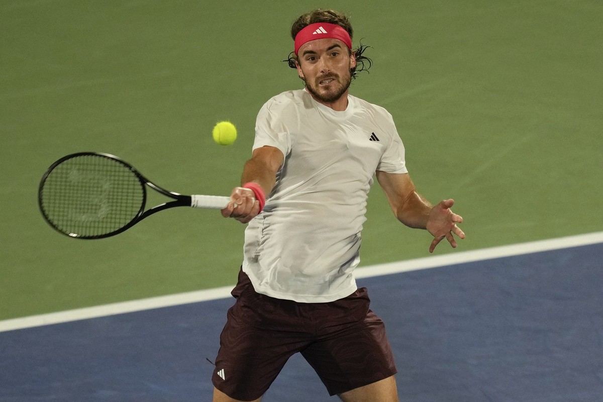 Stefanos Tsitsipas of Greece returns the ball to Felix Auger-Aliassime of Canada during the men's singles final match of Dubai Duty Free Tennis Championship in Dubai, United Arab Emirates, on Sat ...
