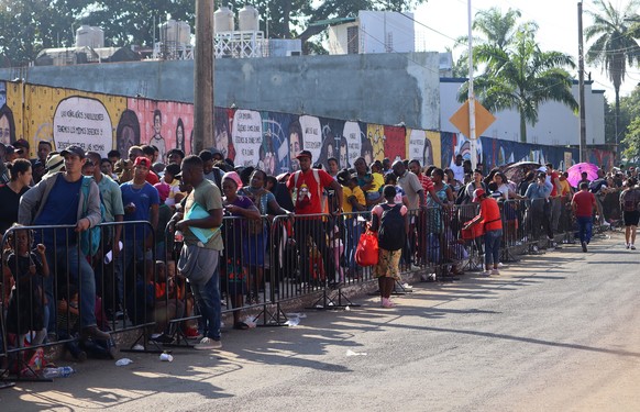 epa10398551 Migrants line up to carry out immigration procedures in the city of Tapachula, Chiapas, Mexico, 10 January 2023. The Center for Human Dignification (CDH) and migrants on the Mexico-Guatema ...