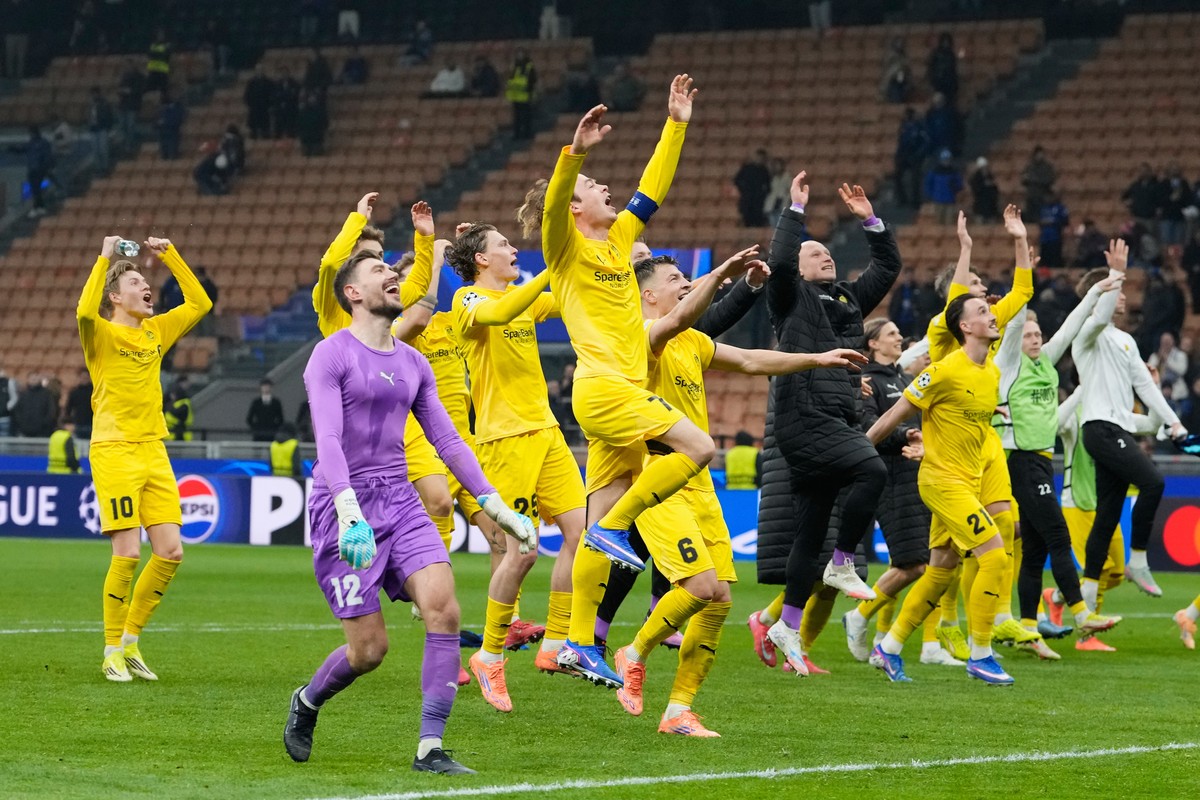 Glimt's players celebrate at the end of the Champions League playoff soccer match between Inter Milan and Bodo Glimt, at the San Siro stadium in Milan, Italy, Tuesday, Feb.24, 2026. (AP Photo/Luc ...