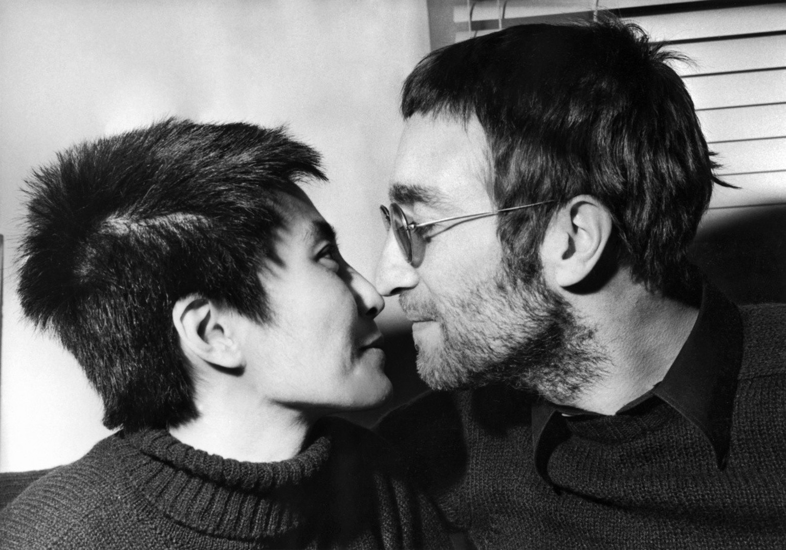 An Eskimokiss (Rubbing noses) is enjoyed by Beatle John Lennon and his japanese wife Yoko Ono, during an interview held in London, 9. February 1970. Last month both had their hair cut short at Aalborg ...