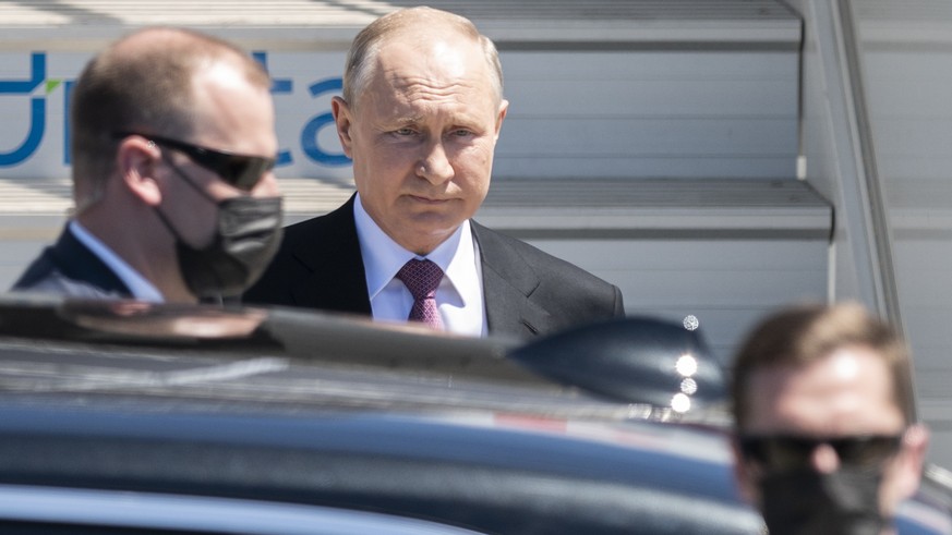 Russian president Vladimir Putin, center gets into his car after his arrival for the US - Russia summit with US President Joe Biden in Geneva, Switzerland, Wednesday, June 16, 2021. (Alessandro della  ...