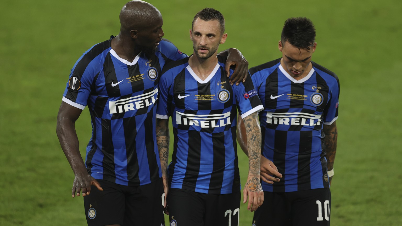 Inter Milan&#039;s Romelu Lukaku, left, Inter Milan&#039;s Marcelo Brozovic, center and Inter Milan&#039;s Lautaro Martinez leave the field at the half time during the Europa League final soccer match ...