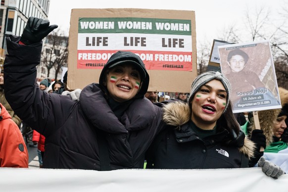 epa10359135 People participate in a rally in Berlin, Germany, December 10, 2022. The non-profit organization for women and girls, Terre des Femmes and other groups called for a rally in solidarity with…