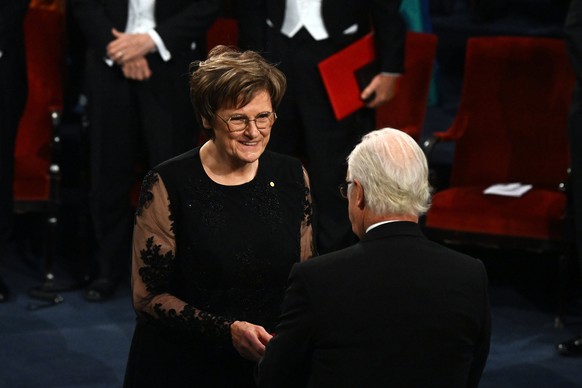 epa11021670 Hungarian biochemist Katalin Kariko is awarded the Nobel Prize in Physiology or Medicine 2023 by King Carl Gustaf (R) of Sweden during the Nobel Prize 2023 award ceremony at the Concert Ha ...