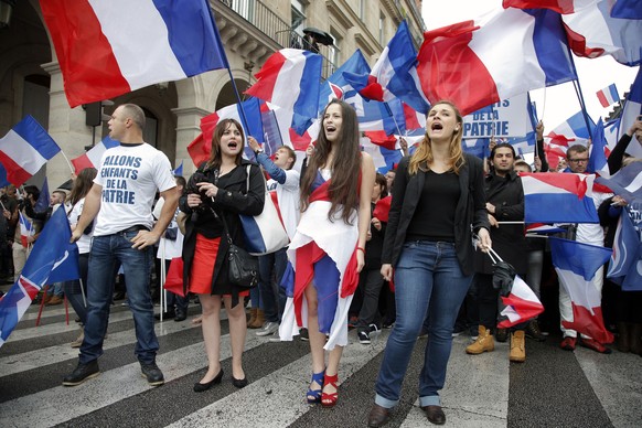 Franceâs far-right National Front demonstrators chant slogans during their annual May Day march, in Paris, France, Friday, May 1, 2015. Franceâs far-right National Front is holding its annual May  ...