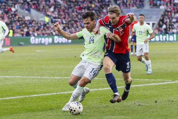 Switzerland's Ardon Jashari, left, and Norway's Kristian Thorstvedt, right, fight for the ball, during a friendly soccer match between Norway and Switzerland at the Ullevaal Stadium in Oslo, ...