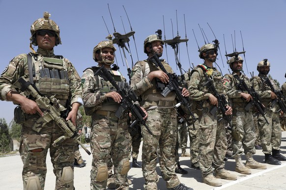 Newly Afghan Army Special forces attend their graduation ceremony after a three-month training program at the Kabul Military Training Centre (KMTC) in Kabul, Afghanistan, Saturday, July 17, 2021. (AP  ...