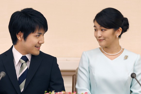 FILE - In this Sept. 3, 2017, file photo, Japan&#039;s Princess Mako and her fiance Kei Komuro look at each other during a press conference at Akasaka East Residence in Tokyo. Mako and Komuro are gett ...