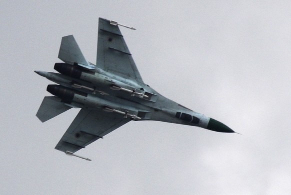 Ukrainian air force Su-27 fighter jet is in the sky outside Slovyansk, 160 kilometers (100 miles) from the Russian border, in eastern Ukraine, Tuesday, April 15, 2014. The Ukrainian government has lau ...