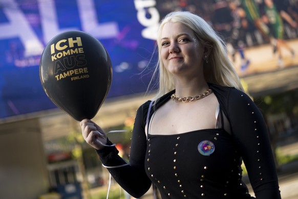 A fan from Finland poses outside the St. Jakobshalle, prior the second semi-final at the 69th Eurovision Song Contest in Basel, Switzerland, on Thursday, May 15, 2025. (KEYSTONE/Til Buergy)