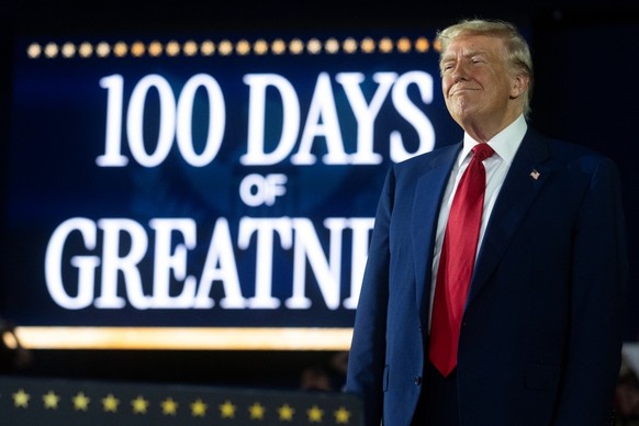 US President Donald Trump delivers a speech marking his 100th day in office at Macomb County Community College Sports Expo Center in Warren, Michigan, on April 29, 2025. Trump celebrated the first 100 ...