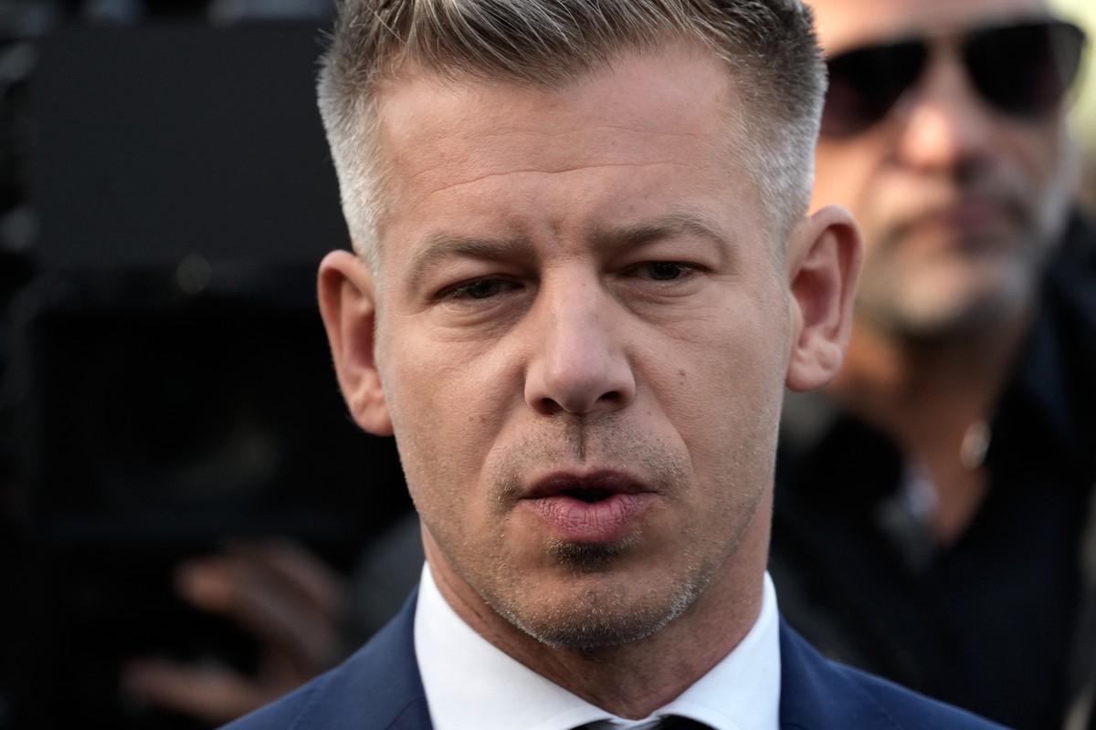 Peter Magyar, the leader of the opposition Tisza party addresses the media outside a polling station after voting in Budapest, Hungary, Sunday, April 12, 2026. (AP Photo/Darko Bandic)
Peter Magyar