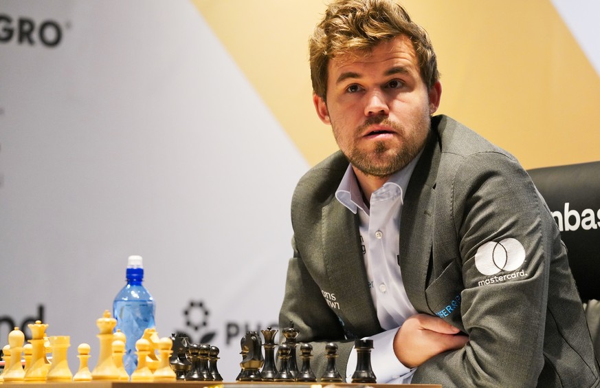 Magnus Carlsen of Norway competes during the FIDE World Championship at Dubai Expo 2020 in Dubai, United Arab Emirates, Friday, Dec. 10, 2021. (AP Photo/Jon Gambrell)
Magnus Carlsen