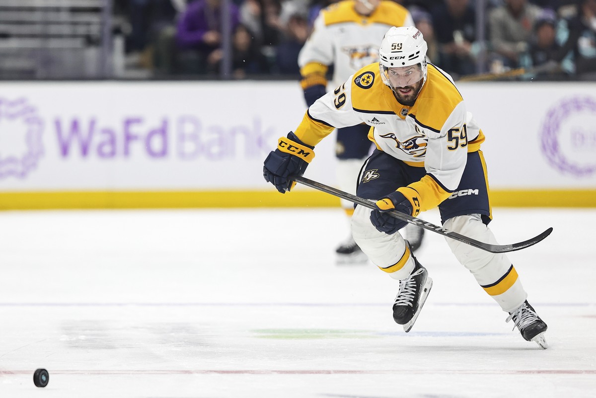 Nashville Predators defenseman Roman Josi (59) skates for the puck during the first period of an NHL hockey game against the Seattle Kraken, Wednesday, Nov. 20, 2024, in Seattle. (AP Photo/Rio Giancar ...