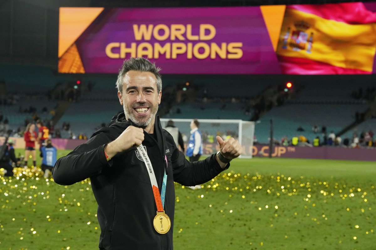 Spain's head coach Jorge Vilda celebrates with the gold medal after the final of Women's World Cup soccer between Spain and England at Stadium Australia in Sydney, Australia, Sunday, Aug. 20 ...