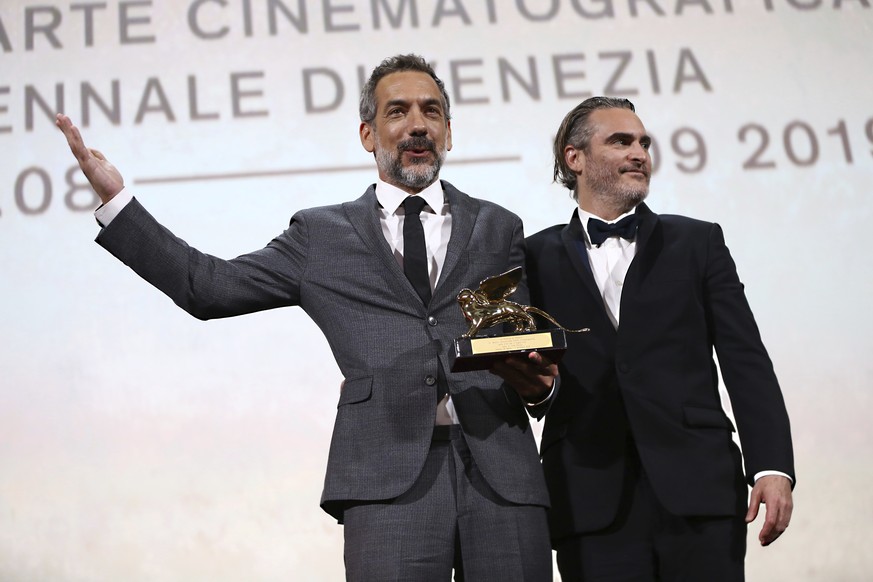 Director Todd Phillips, left, holds the Golden Lion for Best Film for &#039;Joker&#039;, joined by lead actor Joaquin Phoenix at the closing ceremony of the 76th edition of the Venice Film Festival, V ...