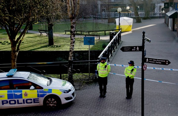FILE - In this Wednesday, March 7, 2018 file photo, police officers guard a cordon around a police tent covering the the spot where former Russian double agent Sergei Skripal and his daughter were fou ...