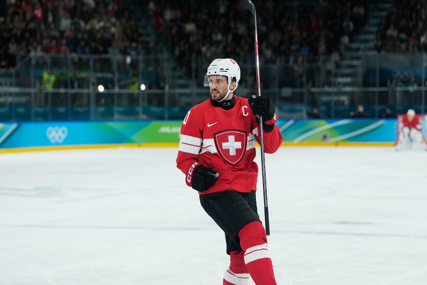 Switzerland's Roman Josi celebrates after scoring his sides second goal during a men's ice hockey qualification playoff game between Switzerland and Italy at the 2026 Winter Olympics, in Mil ...