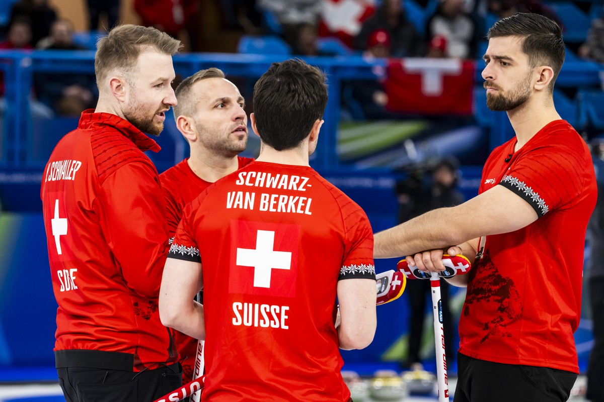 Yannick Schwaller, Sven Michel, Benoit Schwarz-van Berkel and Pablo Lachat-Couchepin of Switzerland, from left to right, react during the men's curling round robin game between Switzerland and Sw ...