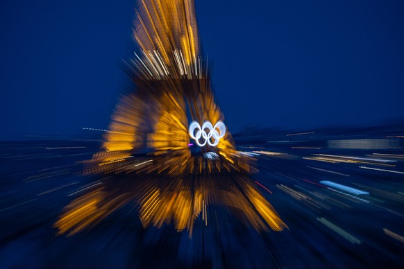 epa11494959 The Eiffel Tower with the Olympic rings is pictured from the Arc de Triomphe prior to the Paris 2024 Olympic Games, in Paris, France, 24 July 2024. The opening ceremony of the Paris 2024 O ...