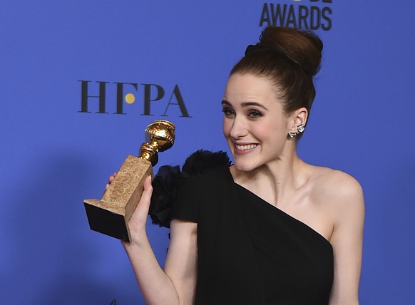 Rachel Brosnahan poses in the press room with the award for best performance by an actress in a television series - musical or comedy for &quot;The Marvelous Mrs. Maisel&quot; at the 75th annual Golde ...