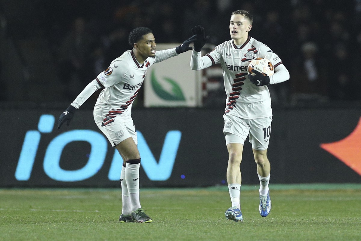 Leverkusen's Florian Wirtz, left, celebrates after scoring his side's first goal during the Europa League round of sixteen, first leg, soccer match between Qarabag and Leverkusen at the Tofi ...