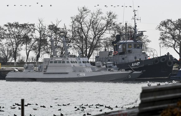 Three Ukrainian ships are seen as they docked after been seized ate Sunday, Nov. 25, 2018, in Kerch, Crimea, Monday, Nov. 26, 2018. The Ukrainian parliament is set to consider a presidential request f ...