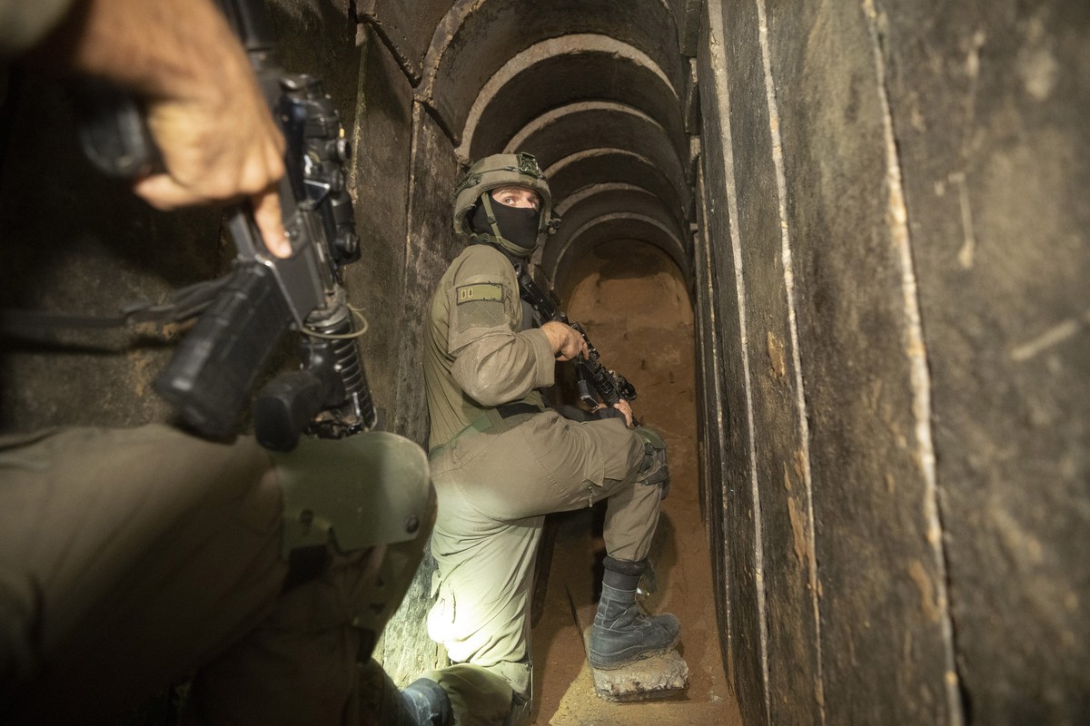 Israeli soldiers escort the media to an underground tunnel found underneath Shifa Hospital in Gaza City, Wednesday, Nov. 22, 2023. Israel says that Hamas militants sought cover on the grounds of the h ...