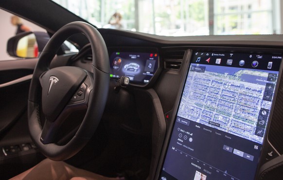 epa06934127 Inside the Tesla Model S at the Tesla dealership showroom in Boston, Massachusetts, USA 07 August 2018. Earlier in the day Tesla founder Elon Musk tweeted, &#039;Am considering taking Tesl ...