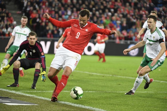 Switzerland&#039;s forward Haris Seferovic, center, reacts after a missed chance next to Northern Ireland&#039;s goalkeeper Michael McGovern, left, and Northern Ireland&#039;s defender Jonny Evans, ri ...