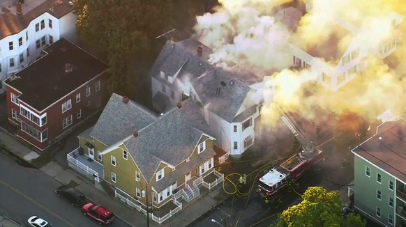 In this image take from video provided by WCVB in Boston, firefighters battle a large structure fire in Lawrence, Mass, a suburb of Boston, Thursday, Sept. 13, 2018. Emergency crews are responding to  ...