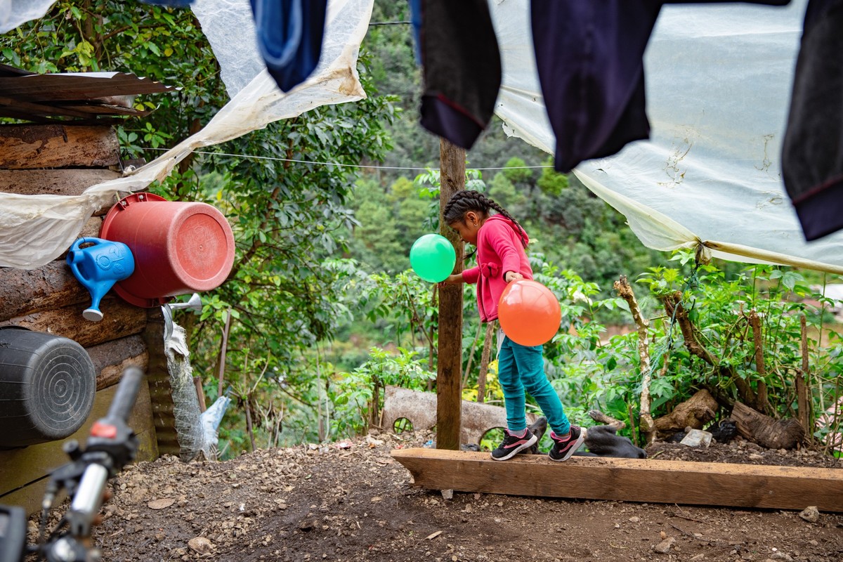 On October 18th, 2021 a little girl who was deported from US to Guatemala plays in the garden of her home in Chiantla, Huehuetenango, Guatemala. “Guatemala is ok says this little girl but I really mis ...