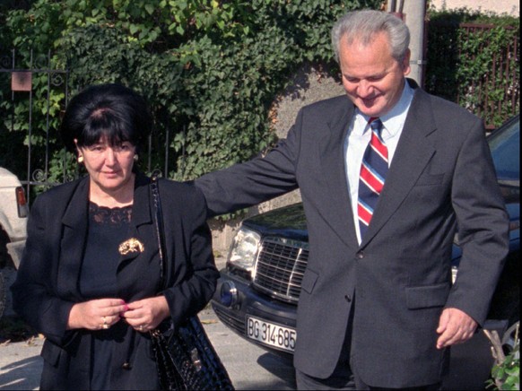 File - In this Sunday, Nov. 3, 1996 file photo, Serbian President Slobodan Milosevic, right, walks with his wife Mirjana Markovic towards the polling station. Serbia’s state television said that Mirja ...