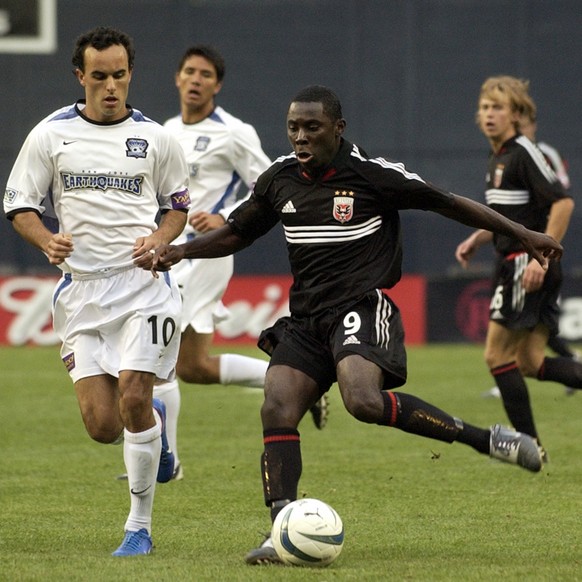 DC United&#039;s Freddy Adu, right, moves the ball past San Jose Earthquake&#039;s Landon Donovan (10) during second half MLS action at RFK Stadium in Washington, Saturday, April 3, 2004. Adu, 14, bec ...