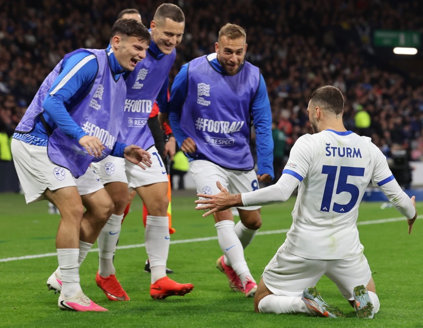 epa13285788 Danijel Sturm of Slovenia celebrates with teammates after scoring the 1-2 goal during the UEFA Nations League match Scotland against Slovenia, in Glasgow, Scotland, Great Britain, 06 Octob ...