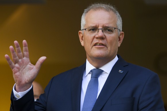 epa09676460 Australian Prime Minister Scott Morrison speaks during a press conference at Parliament House in Canberra, Australia, 10 January 2022. EPA/LUKAS COCH AUSTRALIA AND NEW ZEALAND OUT