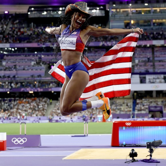 epa11537947 Tara Davis-Woodhall of the USA celebrates winning the Women Long Jump final event of the Athletics competitions in the Paris 2024 Olympic Games, at the Stade de France stadium in Saint Den ...