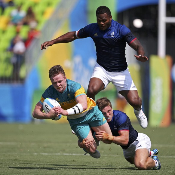 2016 Rio Olympics - Rugby - Preliminary - Men&#039;s Pool B Australia v France - Deodoro Stadium - Rio de Janeiro, Brazil - 09/08/2016. Henry Hutchinson (AUS) of Australia is tackled by Virimi Vakataw ...