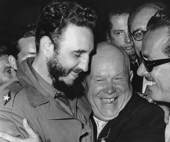 FILE - In a Sept. 20, 1960 file photo, Cuban leader Fidel Castro, left, and Soviet leader Nikita Khrushchev hug at the United Nations. As Castro celebrates his 90th birthday on Aug. 13, 2016, hundreds ...