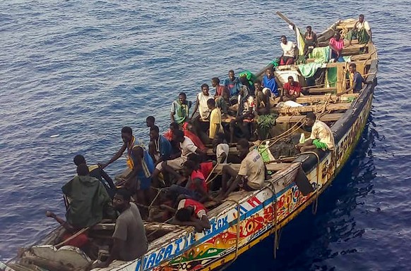 Survivors, mostly from Senegal, are seen inside a pirogue that was found adrift in the Atlantic Ocean by a Spanish fishing vessel near Cape Verde on August 14, 2023. The boat had set off from Senegal  ...