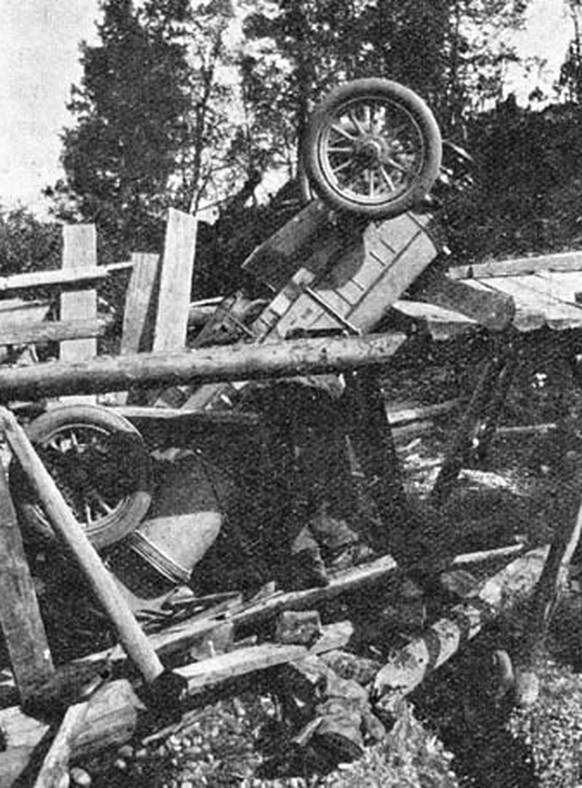 Peking to Paris Rally 1907.
Hazards of the road: Borghese &amp; Barzini's Itala having fallen through a bridge
https://en.wikipedia.org/wiki/Peking_to_Paris
