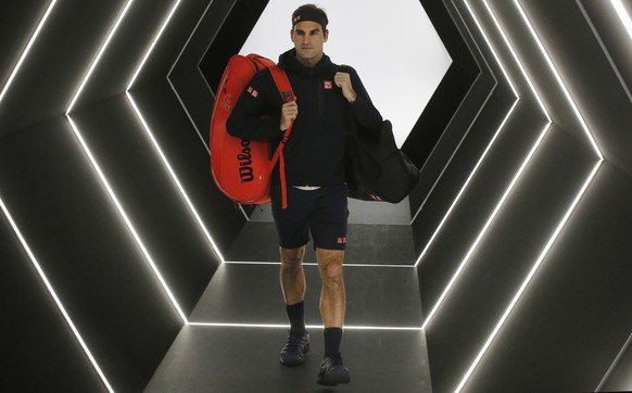 Roger Federer of Switzerland arrives to plays against Fabio Fognini of Italy during their third round match of the Paris Masters tennis tournament at the Bercy Arena in Paris, France, Thursday, Nov. 1 ...