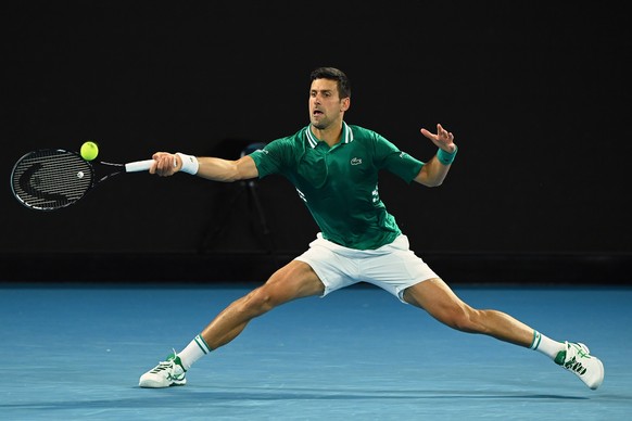 epa09015753 Novak Djokovic of Serbia in action during his Men&#039;s Quarter finals singles match against Alexander Zverev of Germany on Day 9 of the Australian Open at Melbourne Park in Melbourne, Au ...