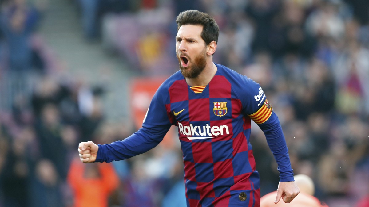 Barcelona's Lionel Messi celebrates after scoring his side's opening goal during a Spanish La Liga soccer match between Barcelona and Eibar at the Camp Nou stadium in Barcelona, Spain, Satur ...